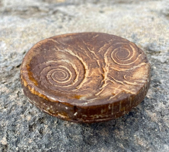 Brown Whirlpool incense holder with lighter spiral pattern and round pedestal foot